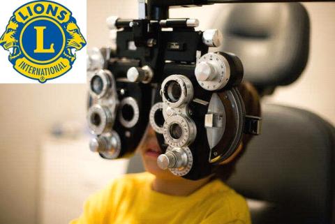 Lions Club Logo with Child taking a vision test