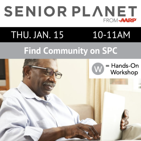 A person is sitting with an open laptop and typing.