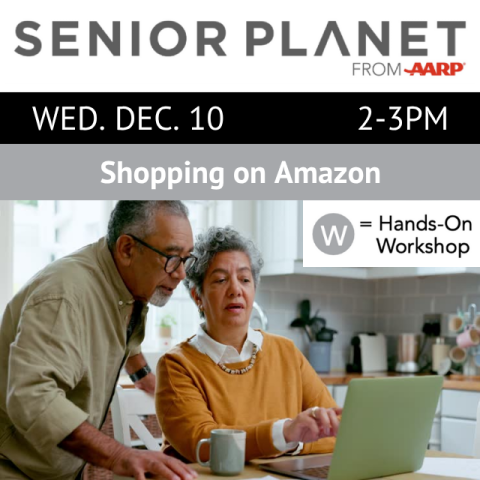 Two people looking at a laptop.