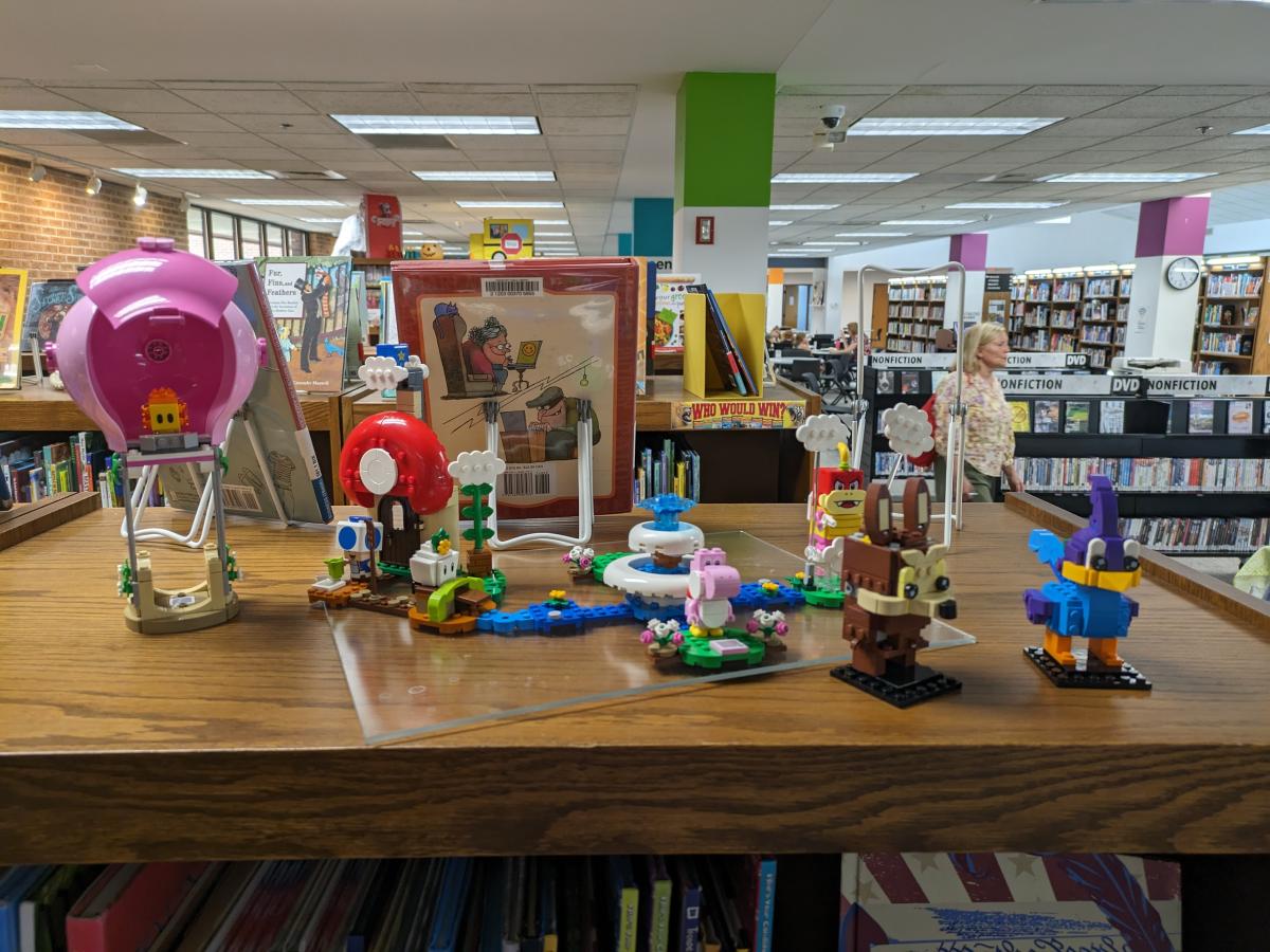 Photo of Super Mario Bros. Lego Kit on top of a bookshelf