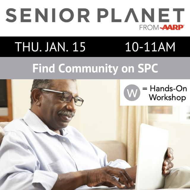 A person is sitting with an open laptop and typing.