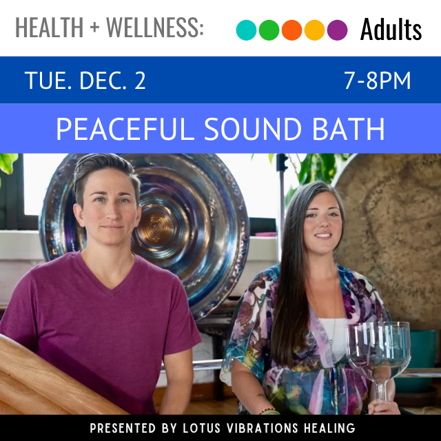 Two people surrounded by gongs and musical instruments.